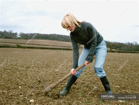 woman digging through wall